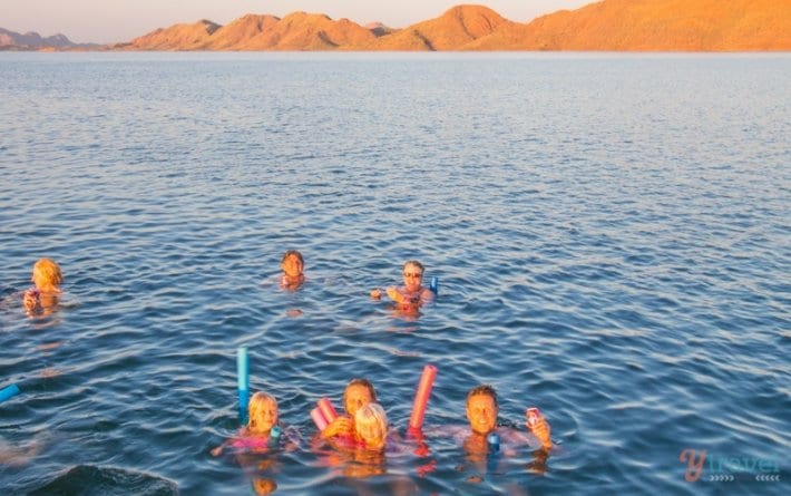 people swimming in lake argyle