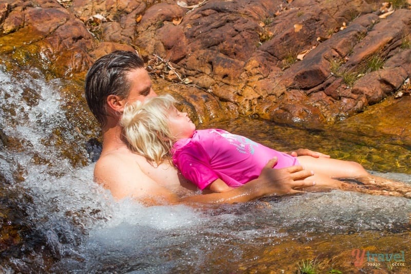 savannah sitting on craig's lap in the water hole  Litchfield National Park, Northern Territory