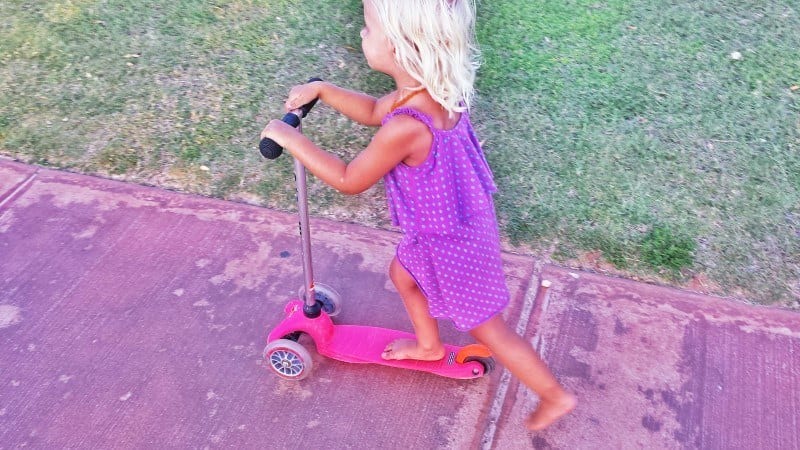 girl riding on a scooter