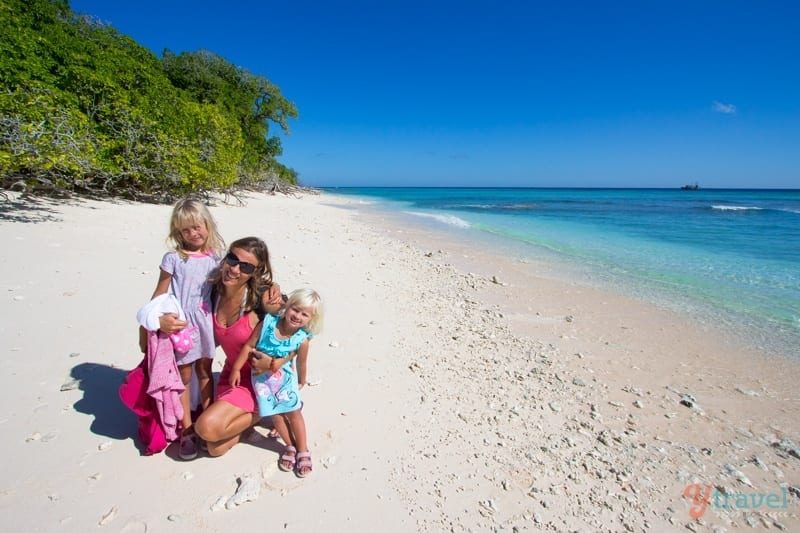 family posing on the beach at Lady Musgrave Island 