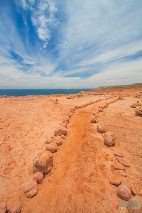 dirt walking trail on a cliff