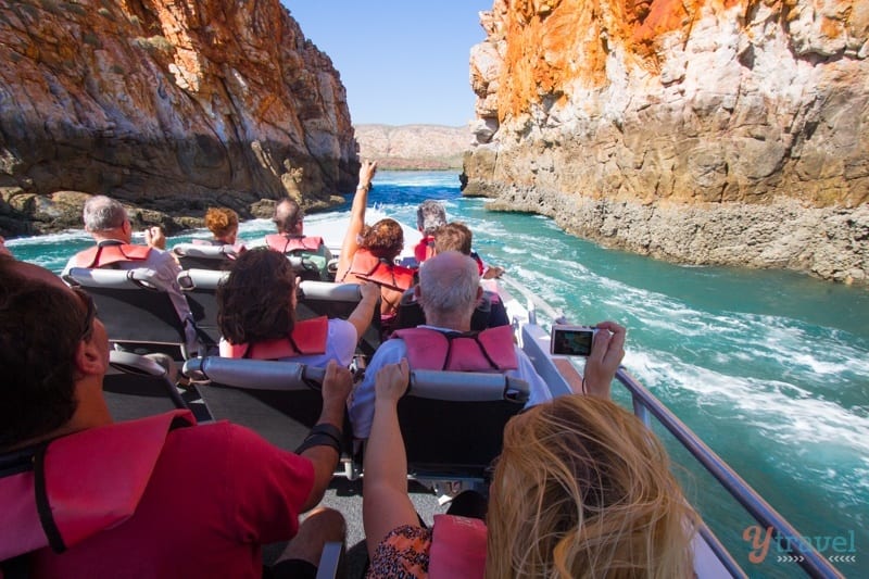 people sitting in front of boat looking at horizontal falls