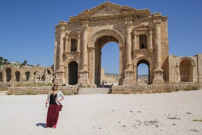 woman standing in front of archway at Jerash Jordan