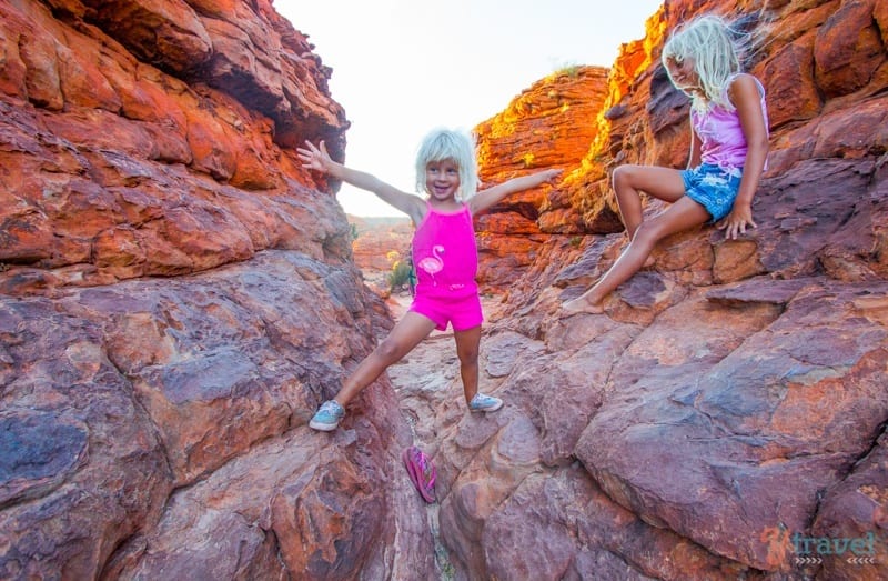 girls climbing on rocks