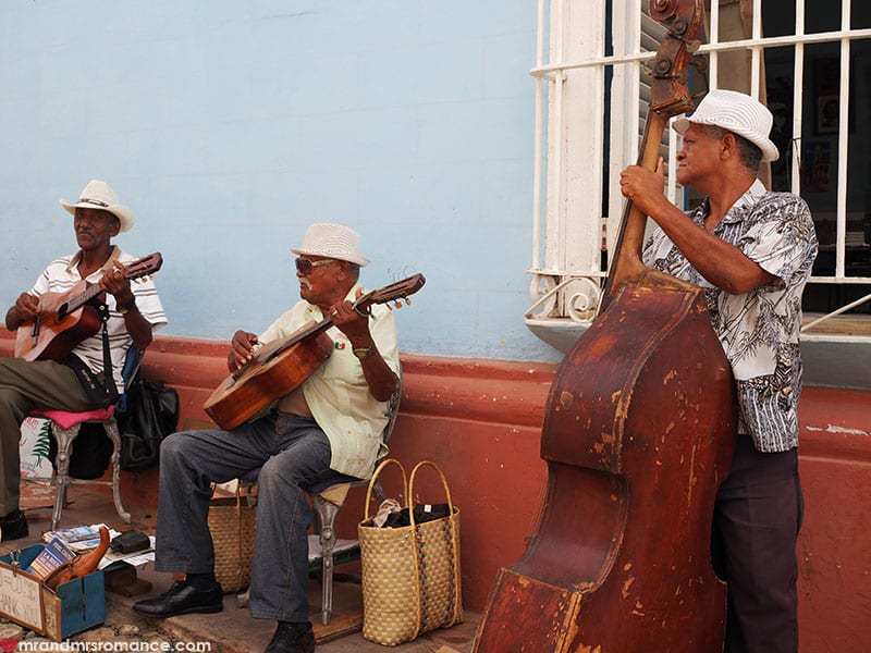 men playing instruments on the street