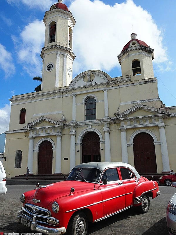 A car parked in front of a church
