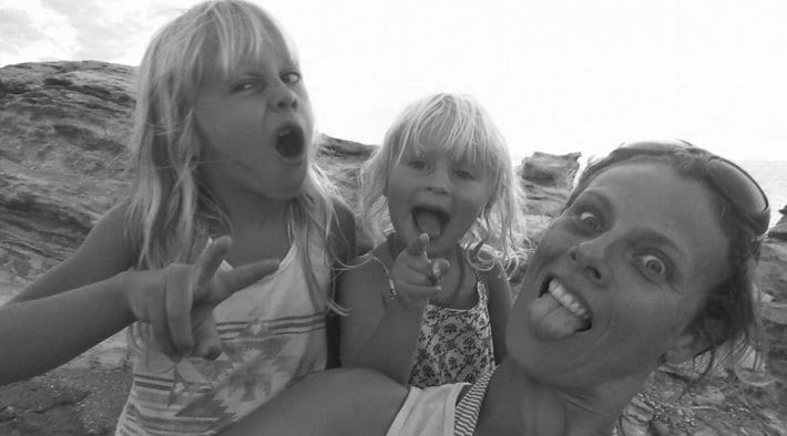 woman and little girls making silly faces