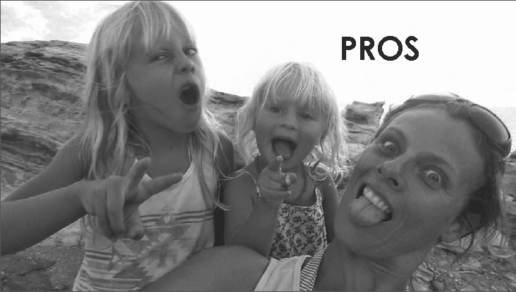 woman and two girls pulling funny faces to camera