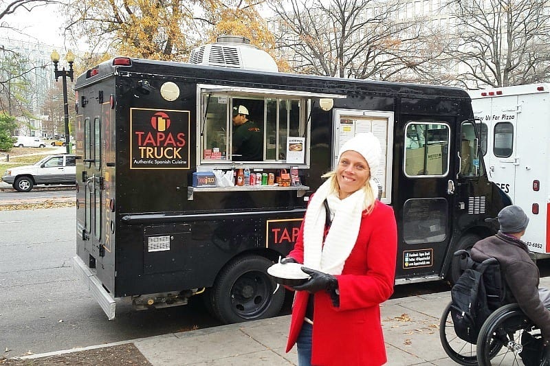 woman standing in front of food truck