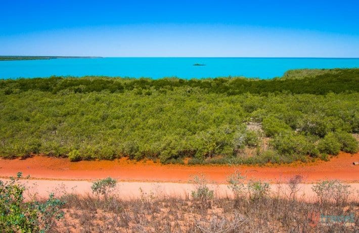 the colors of broome - red dust, green shrub, turquoise water, blue sky