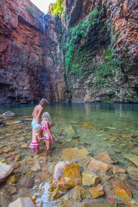 woman and girls walking into water at Emmas Gorge, Western Australia