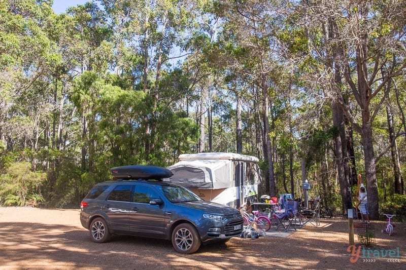 car and caravan in a camping ground