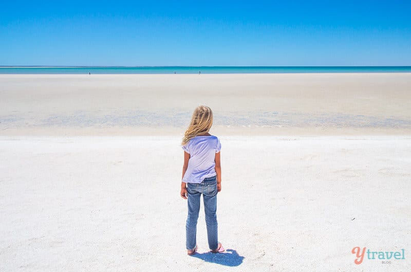 girl standing on Shell Beach