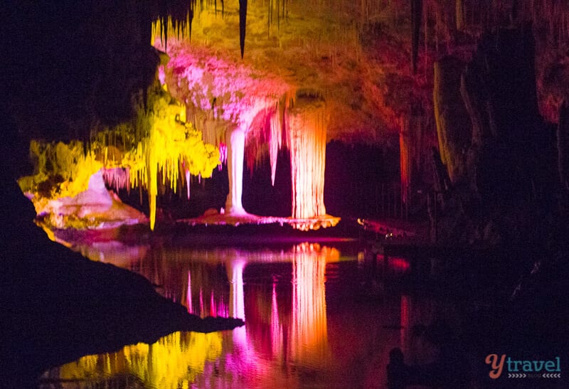 colorful lights on stalagmites on at Lake Cave in Western Australia