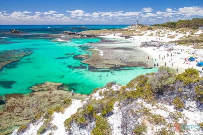 white beaches and aqua water of Rottnest Island with lighthouse in the background