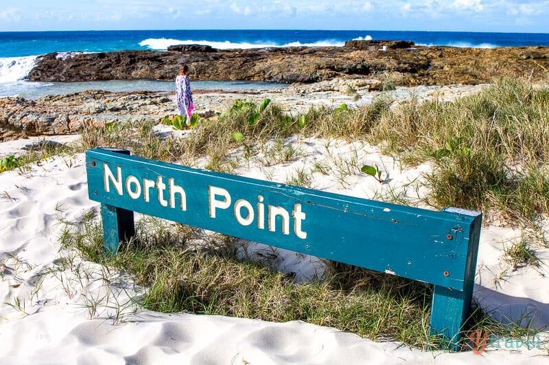 a sign on the sand that says North Point