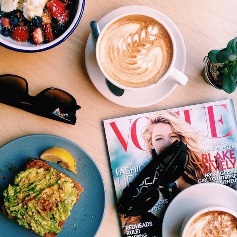 magazine latte and avo toast on table at Two Hands
