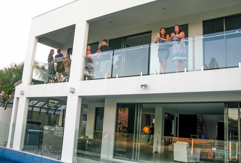 people standing on a house balcony