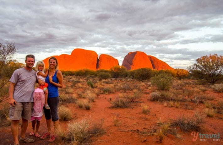 family posing at Sunset at Kata Tjuta in the Northern Territory of Australia