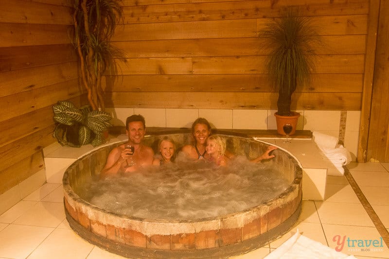 people sitting in a hot tub