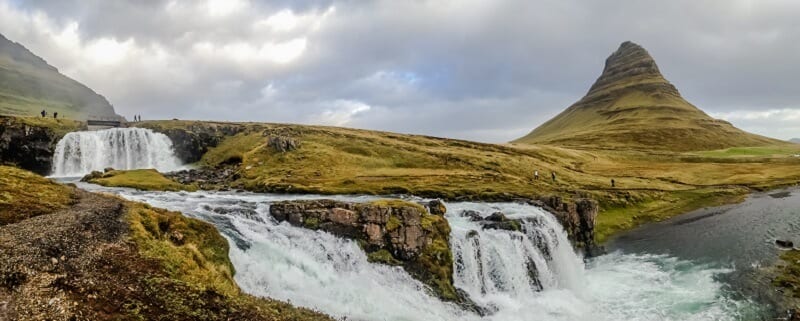 Kirkjufell waterfall streaming over cliff