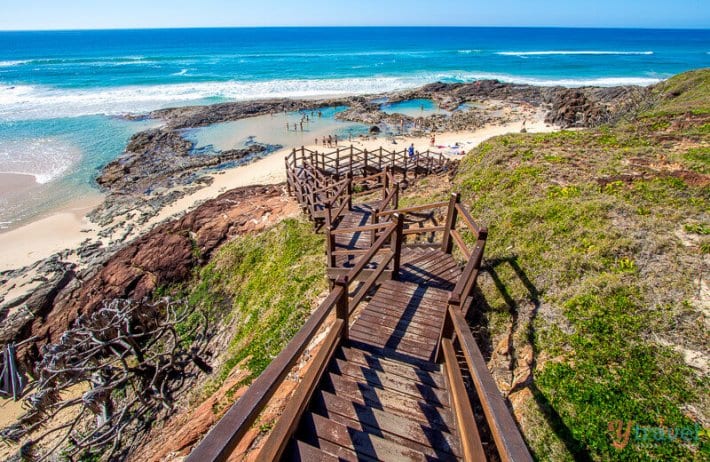 boardwalk leading to Champagne Pools on the edge of the beach