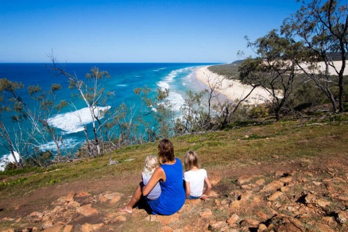 woman and children looking at view of 75 mile beach from indian head
