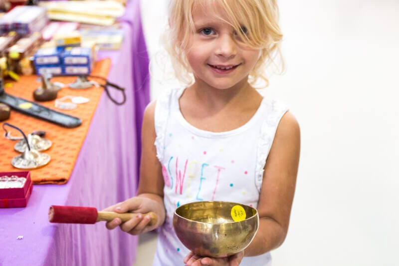 young girl with sound bowl