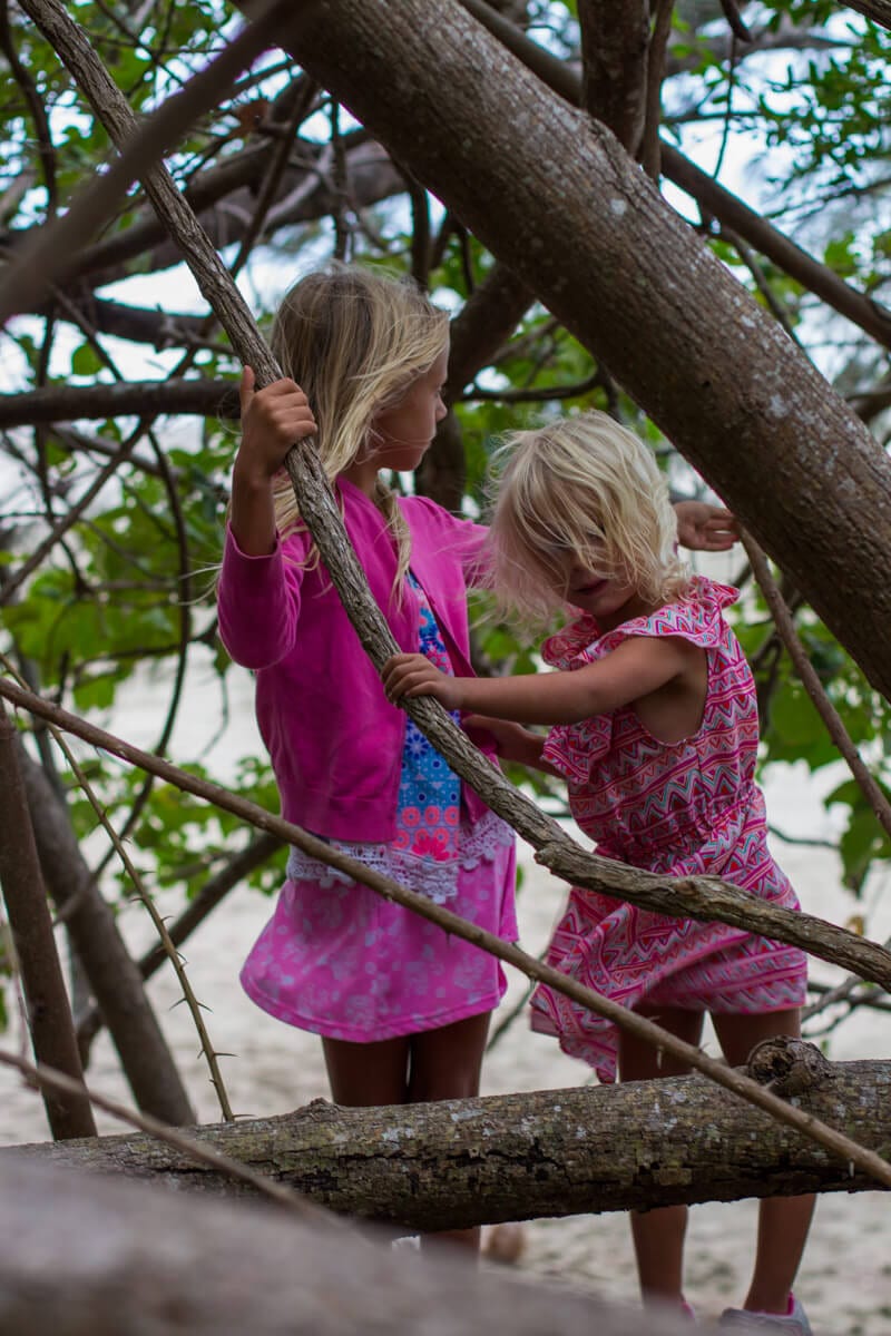 girls playing on trees on Cape Hillsborough National Park