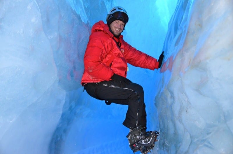 man climbing glaciers