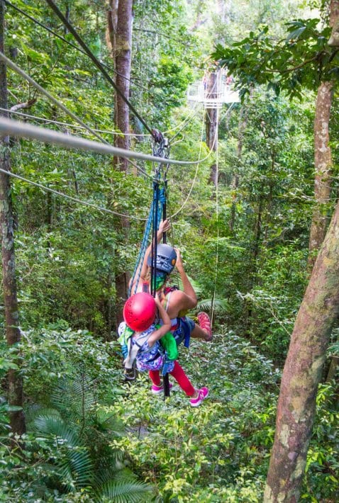 two girls on Jungle Surfing (zip lining) in the Daintree Rainforest of Queensland, Australia