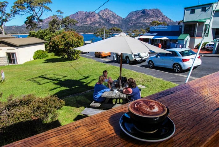Coffee on high top bar with view of mountains inin Coles Bay - Tasmania, Australia