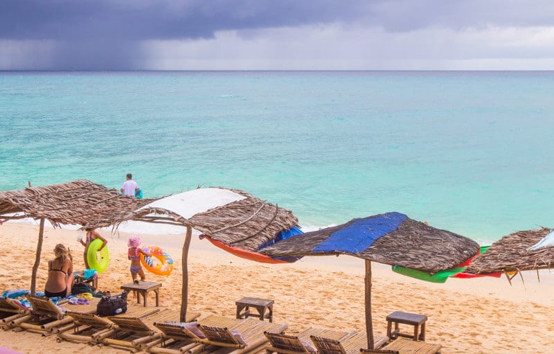 thatched umbrellas on puka beach