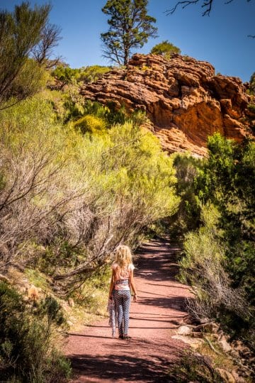 girl walking on a hiking path