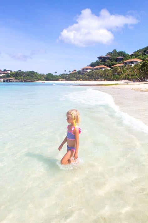 young girl in water of Punta Bunga Beach, Boracay Island, Philippines
