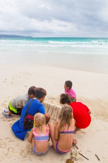 White Beach Boracay Island is one of the best beaches in the Philippines. Sand sculpting is very popular Click to read tips on things to do in Boracay with kids.