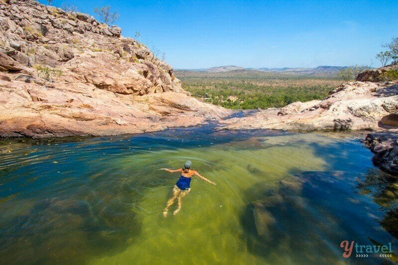 woman swimming in gunlom falls Kakadu National Park, Northern Territory