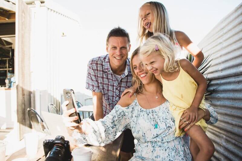 family posing for selfie
