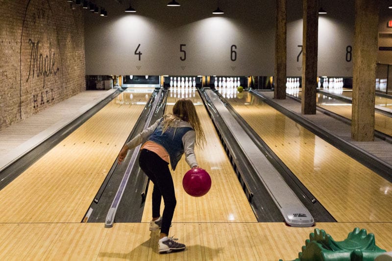 girl bowling astatine  Maple Hall Bowling