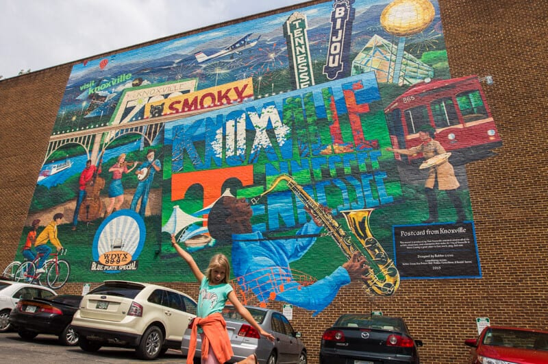 girl in front of mural at  Knoxville Visitors Center f