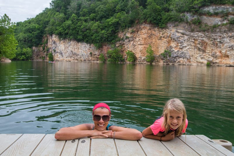 woman and miss  smiling astatine  camera swimming Meads Quarry