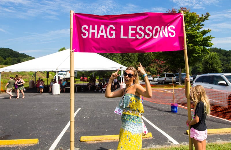 person pointing at sign Shag lessons at the Dirty Dancing festival