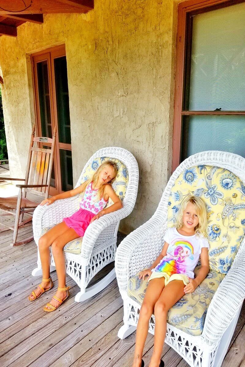 girls sitting on porch of Historic Home at Barnacle State Park in Coconut Grove
