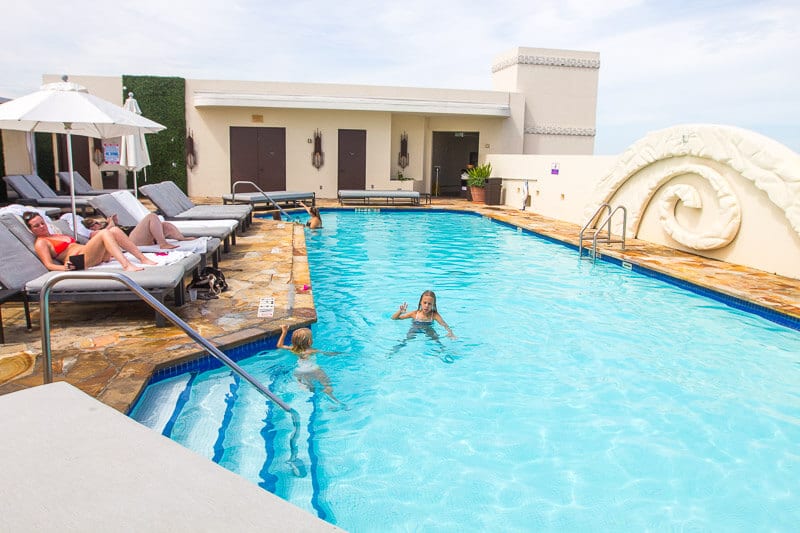 girl swimming in hotel pool