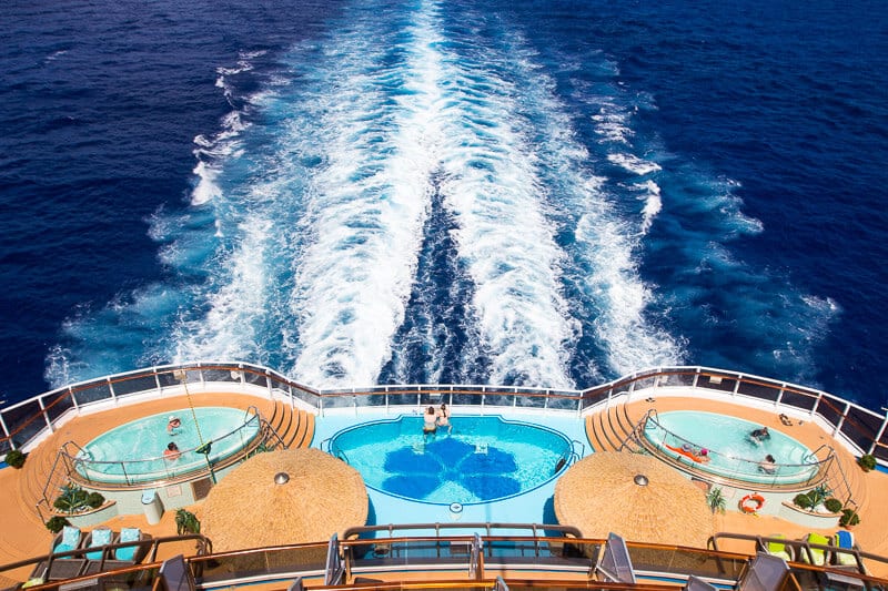 pool on deck of cruise with views of ocean