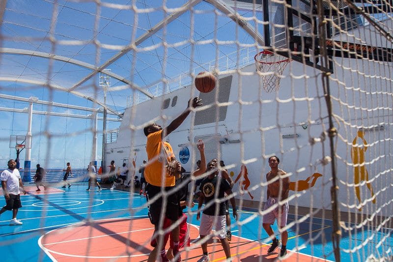 people playing basketball on a cruise deck