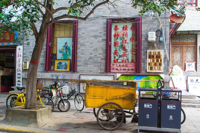 bikes in front of paintings on wall