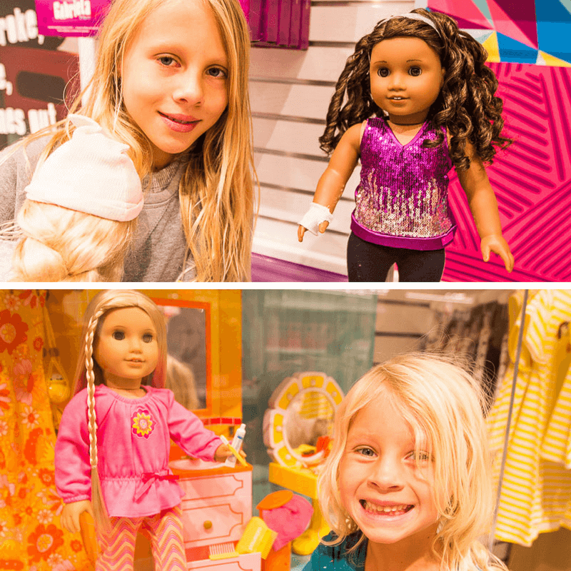 young girls with American Girl Dolls in the store