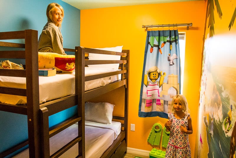 girls sitting on bunk beds