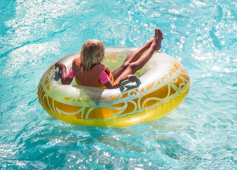 girl on tube on Lazy River at Volcano Bay